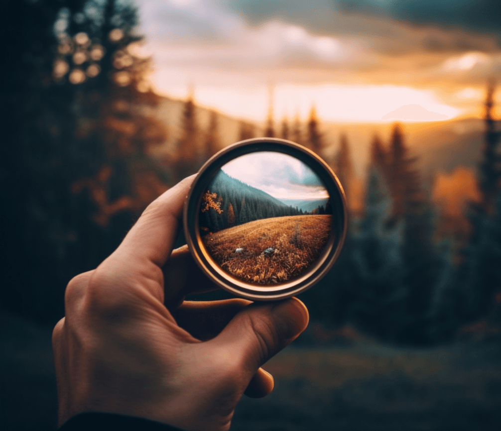 close up hands holding vintage camera taking photo